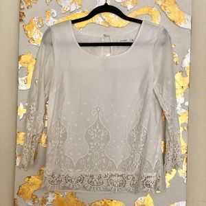 White top with embroidered details